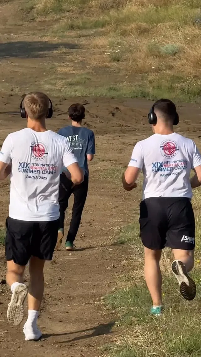 Camp athletes on a morning hill run outside Tbilisi, in International Martial Arts Summer Camp shirts